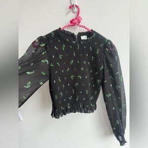Aritzia Wilfred Tempest blouse
XS
Black with green leaf print